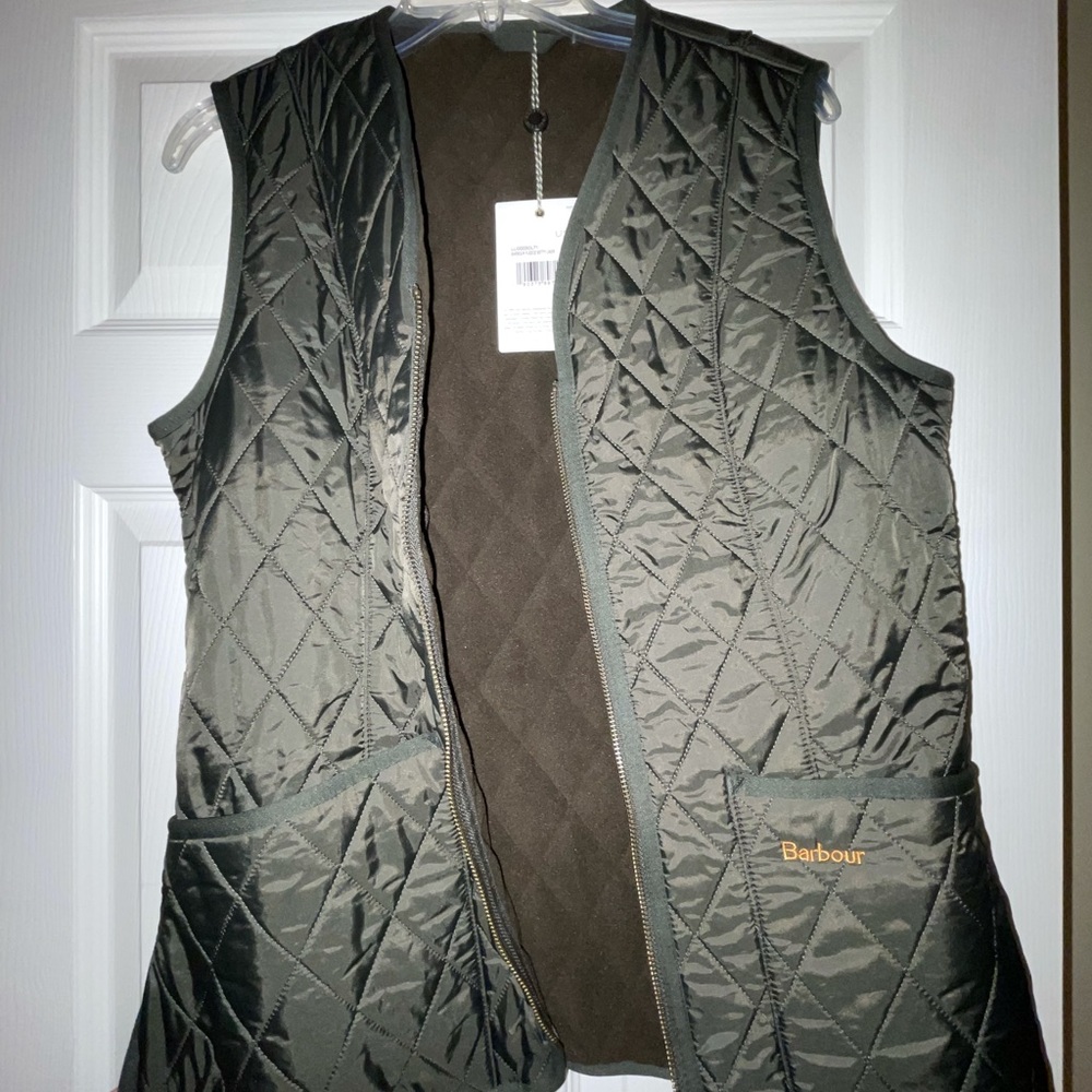 Barbour jacket vest with tags on it